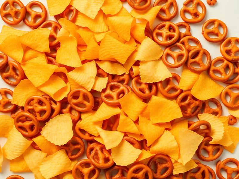Snack products packaged in custom flexible film