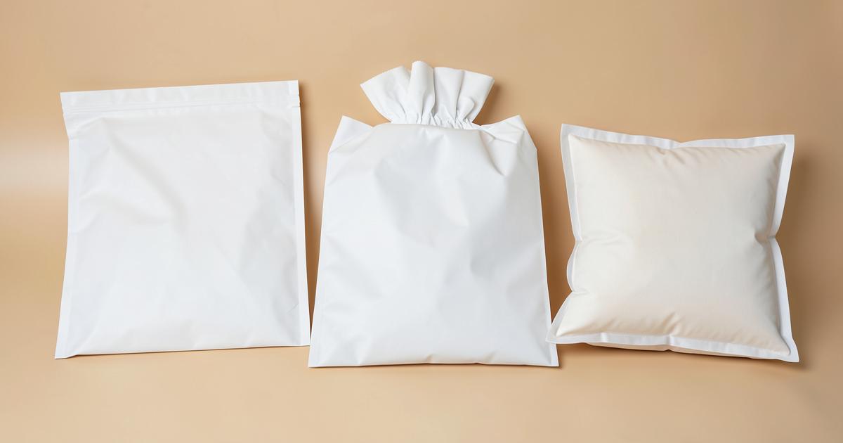 Assortment of blank flexible packaging bag formats including flat bottom and pillow bags